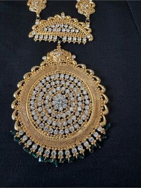 Gold-Tone Circular Pendant Necklace with Clear Crystals and Green Accents